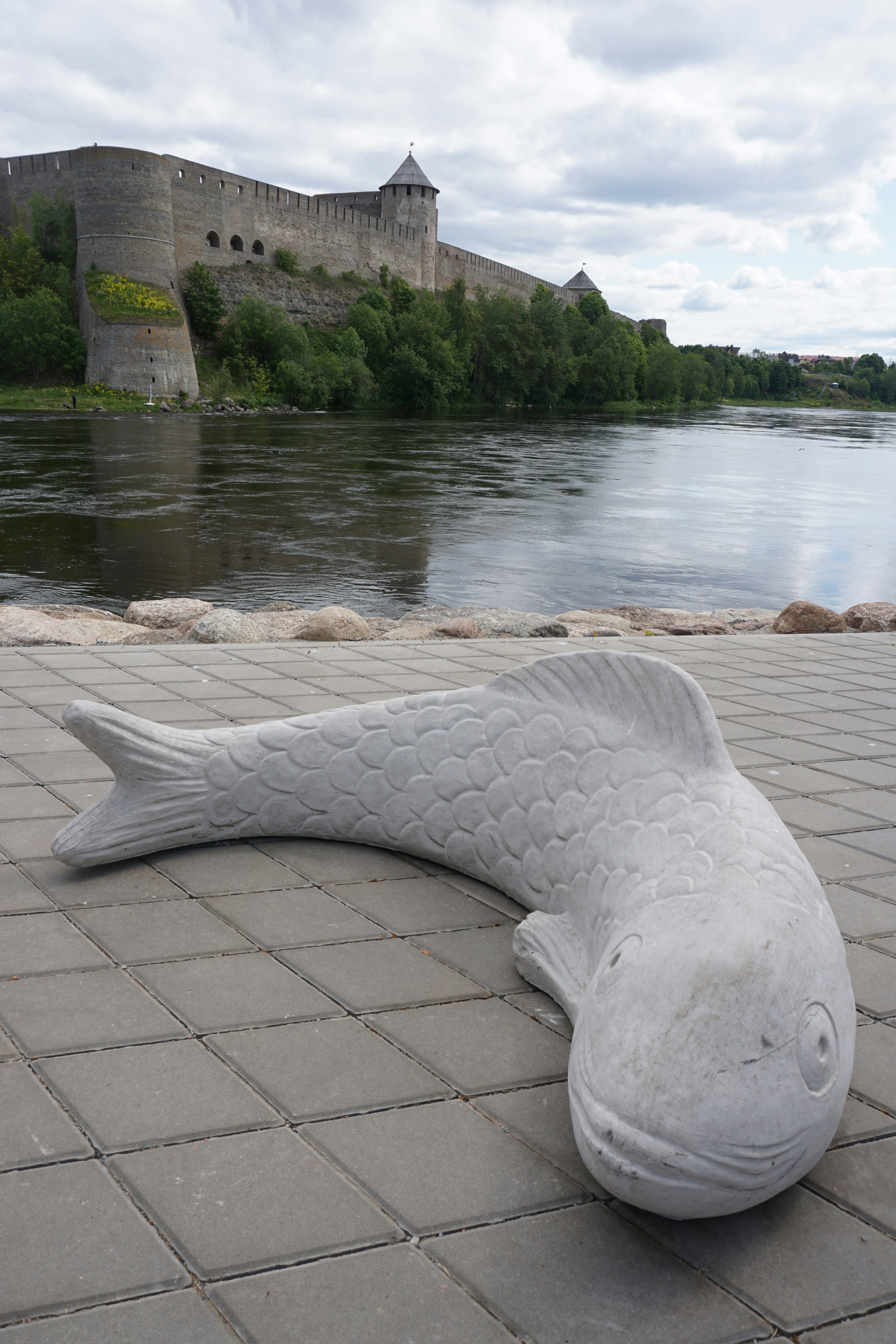 A fish statue at the Narva river. The river marks the border between Estonia and Russia. On the other side of the river is the Russian Ivangorod Castle